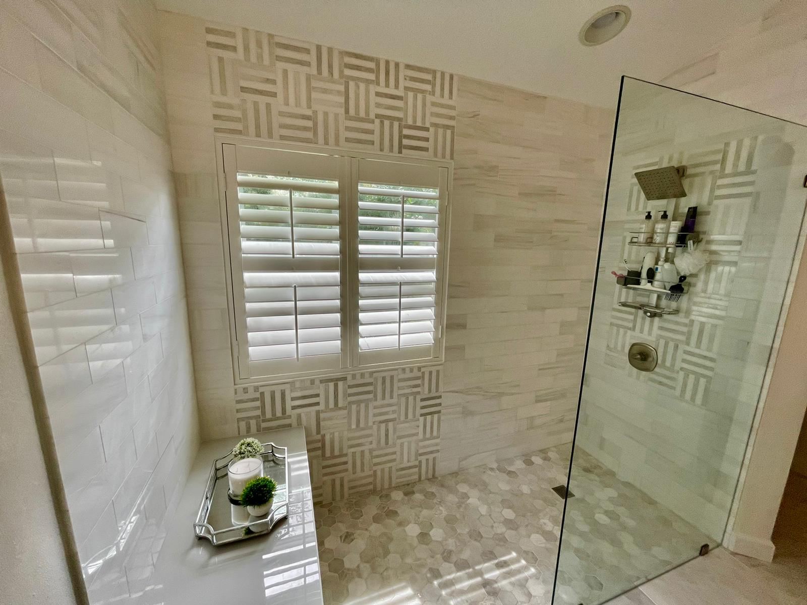 Finished shower with basket-weave mosaic accent and hexagon floor