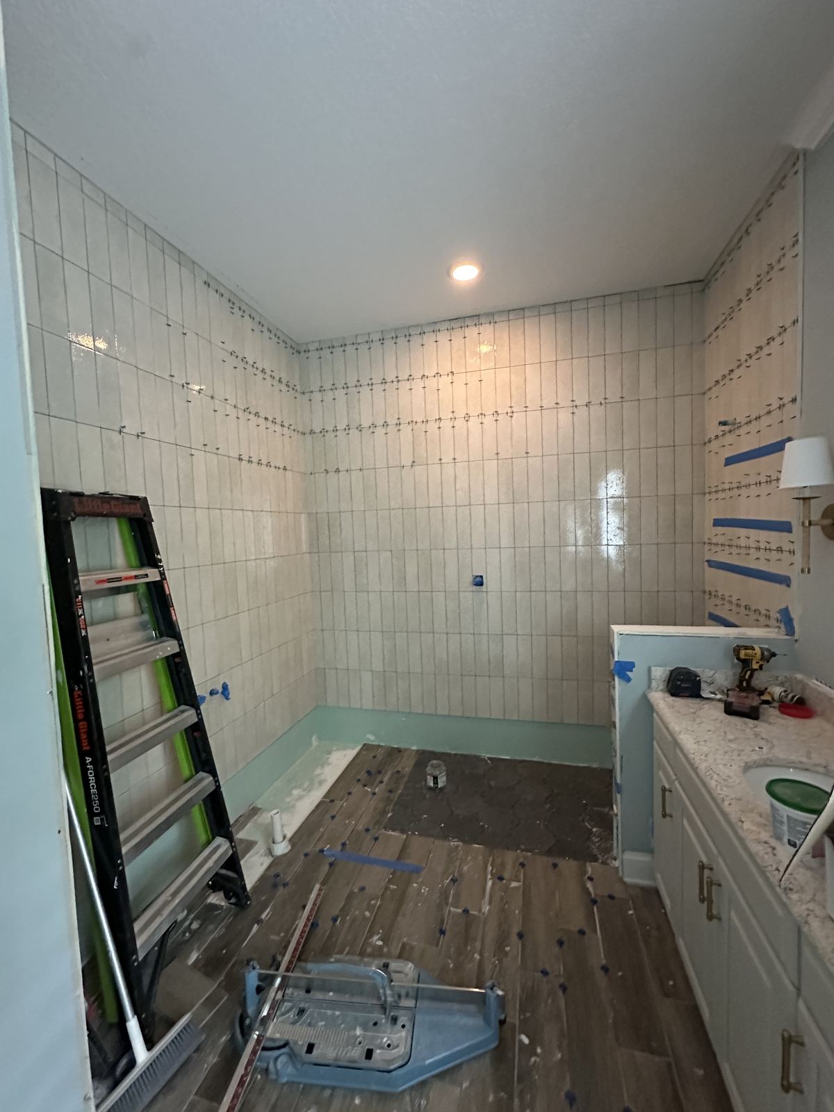 Bathroom wall tile installation in progress
