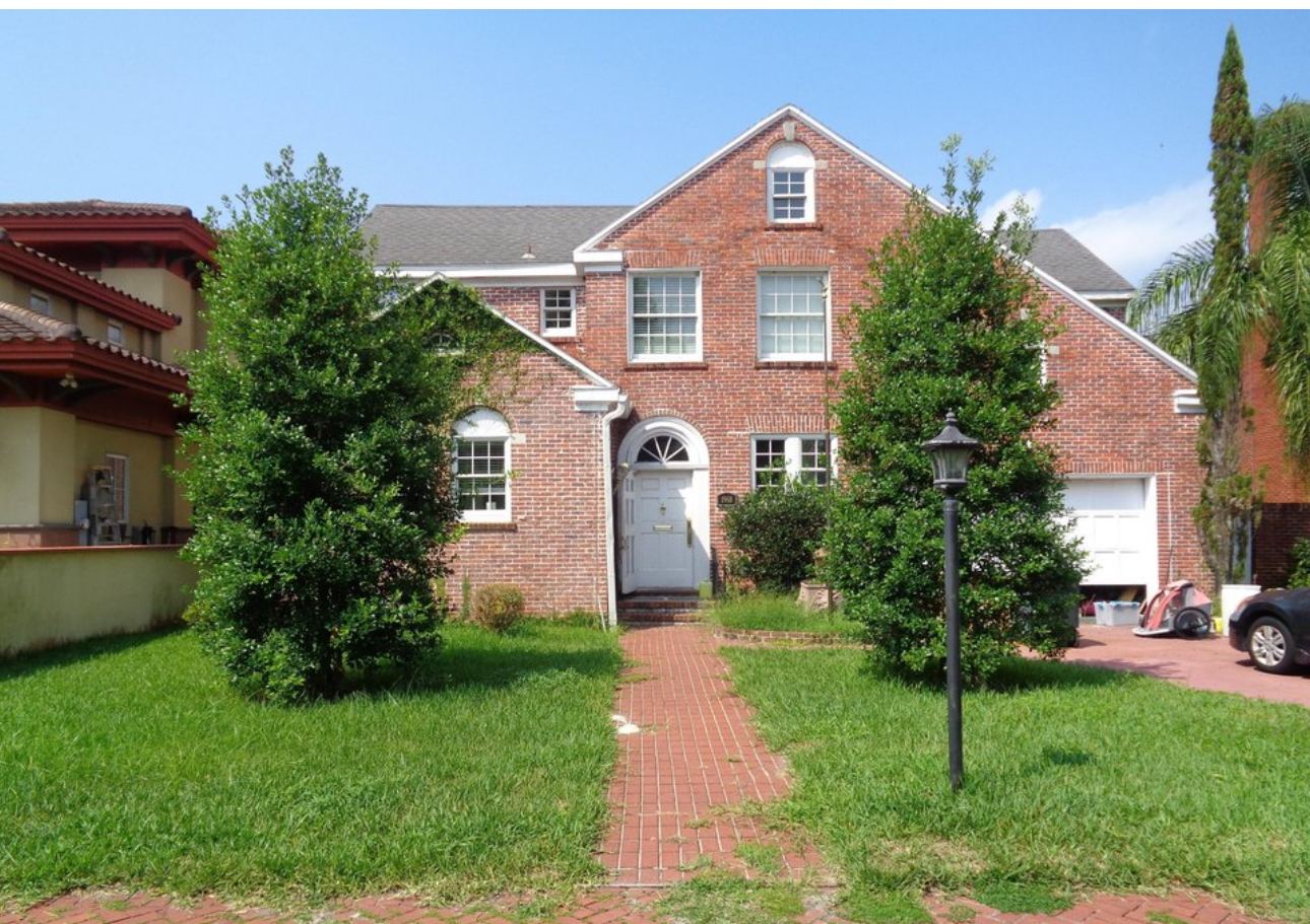 Original red brick colonial home before renovation