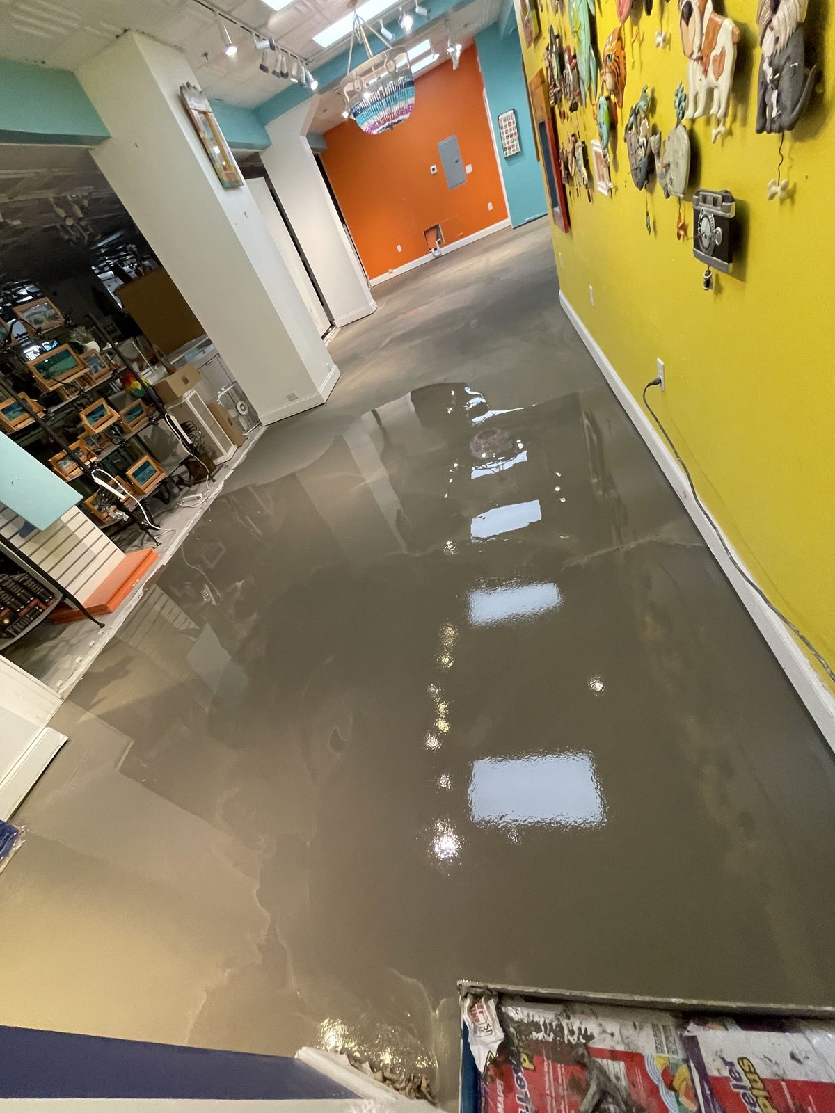 Self-leveling compound poured across the gift shop floor