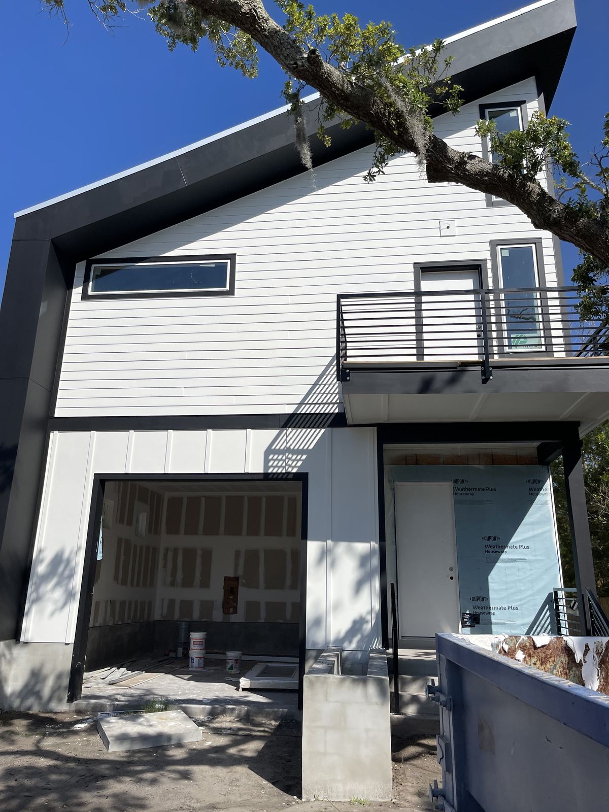 Siding installation in progress on home exterior