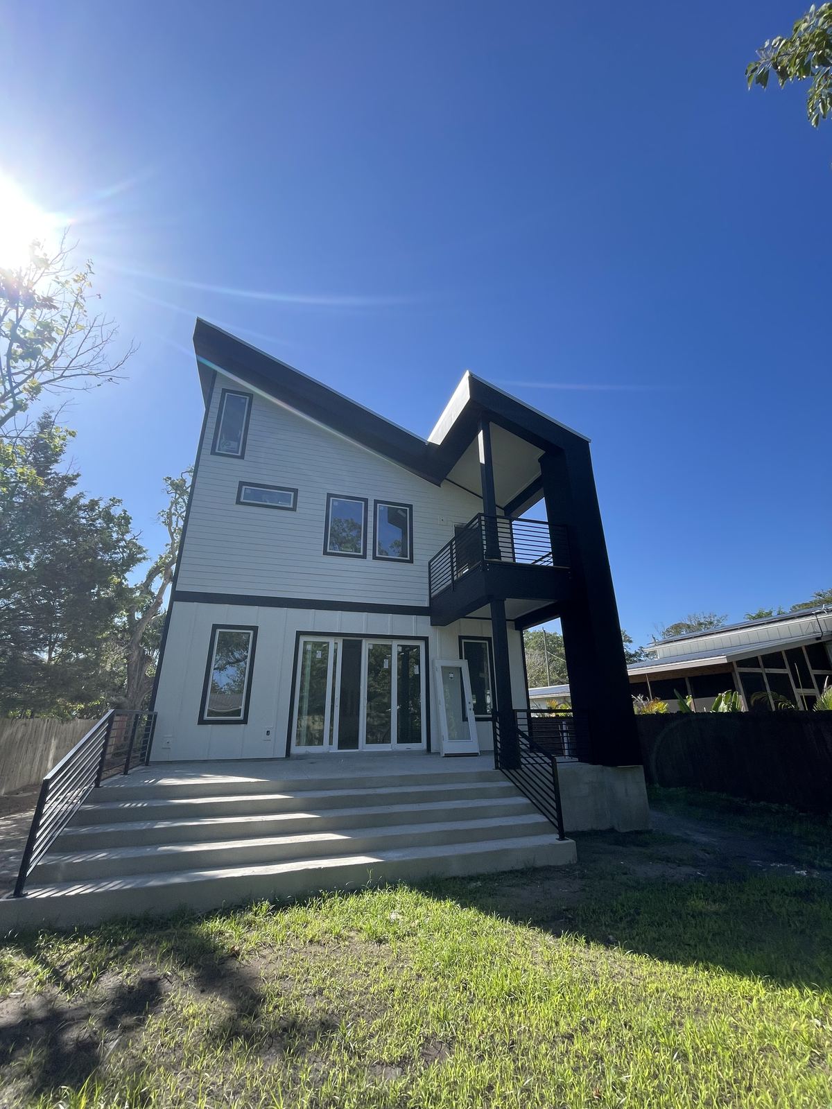 Finished modern home construction with angled roofline