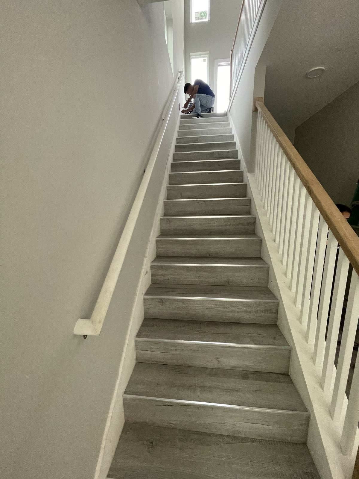 Finished staircase with new wood-look flooring