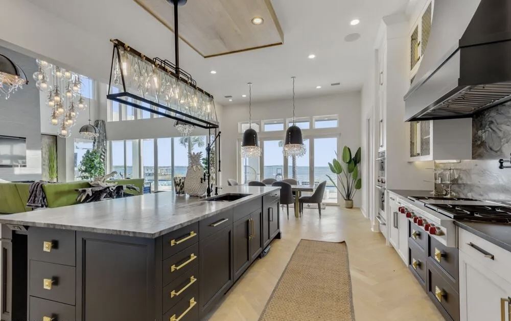 Remodeled kitchen range wall with marble backsplash