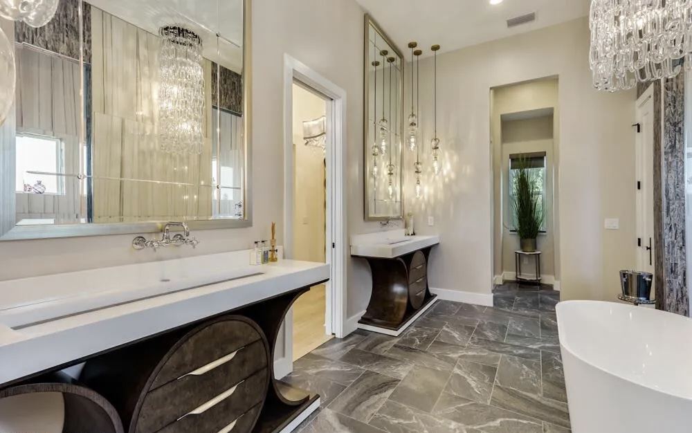 Primary bath dual dark wood vanities